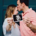 Some friends of mine holding an ultrasound picture of their sweet baby