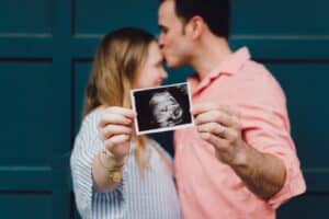 Some friends of mine holding an ultrasound picture of their sweet baby