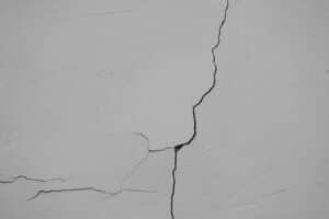 a crack in the side of a white wall