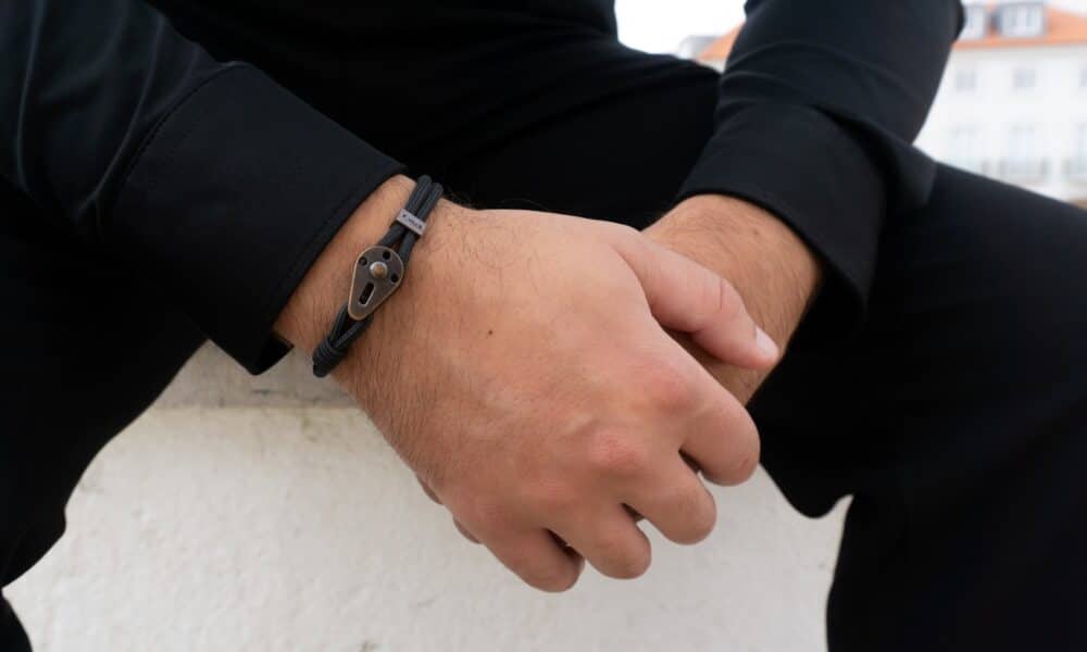 person wearing silver link bracelet