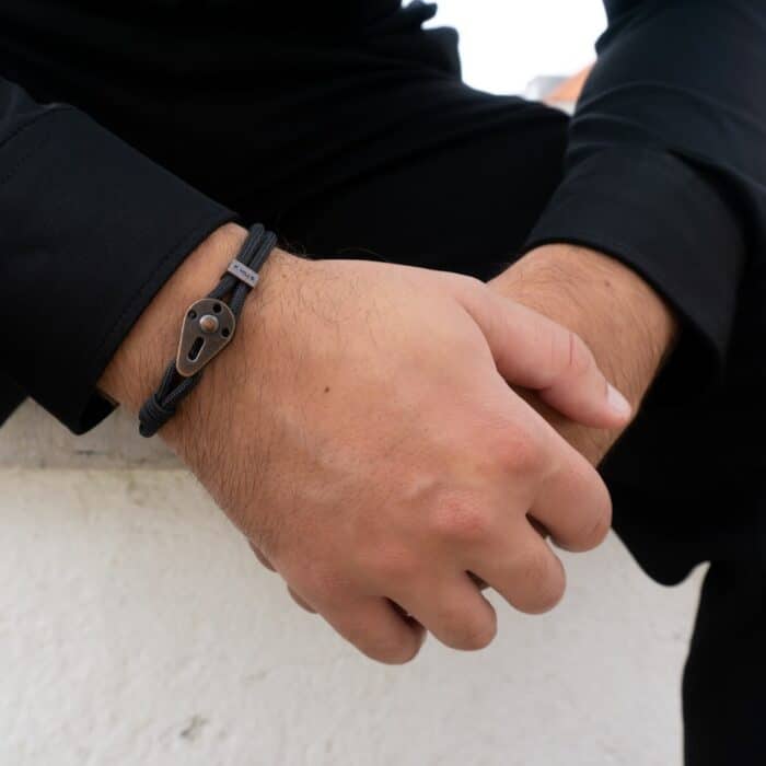 person wearing silver link bracelet
