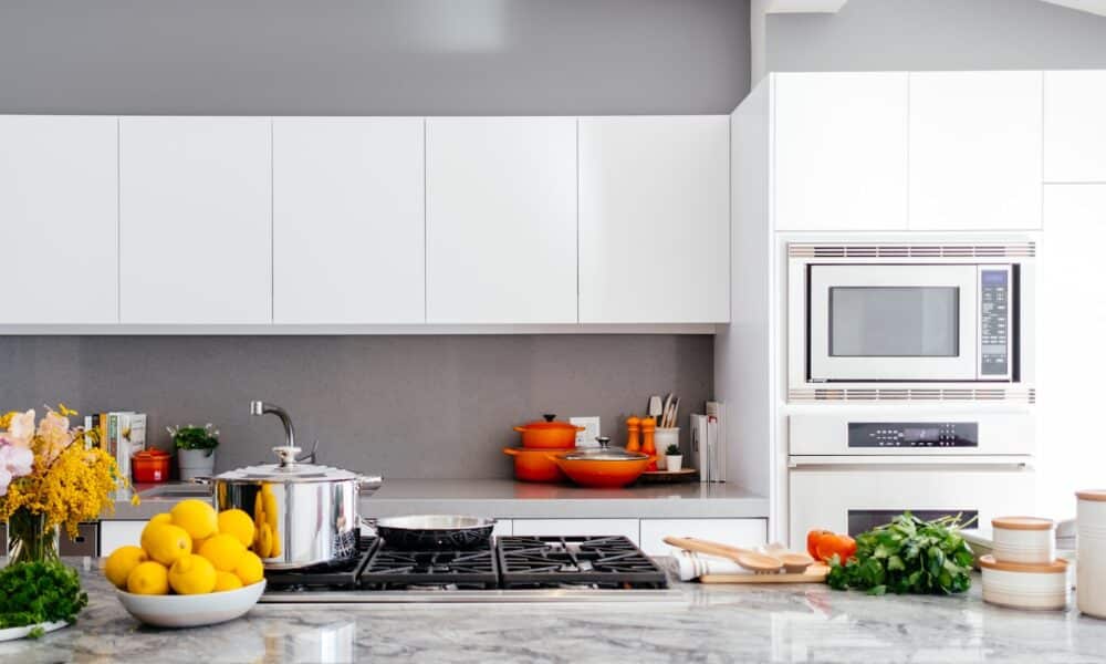 modern white kitchen with marble island