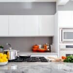 modern white kitchen with marble island