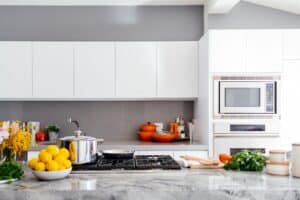 modern white kitchen with marble island