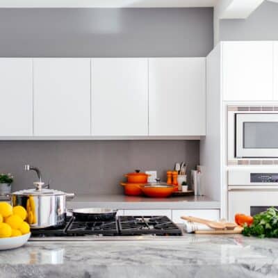 modern white kitchen with marble island