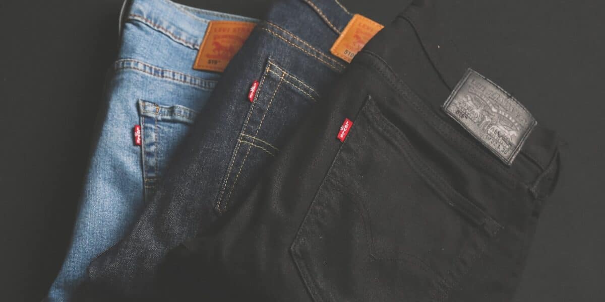 three assorted-color denim bottoms