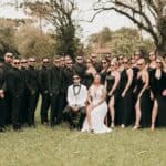 a group of people in formal wear posing for a picture