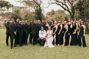 a group of people in formal wear posing for a picture